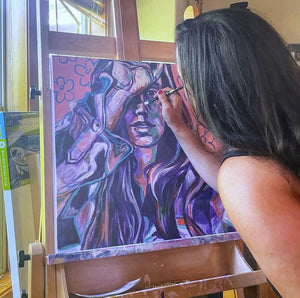 Contemporary artist paints an intimate self portrait on her easel